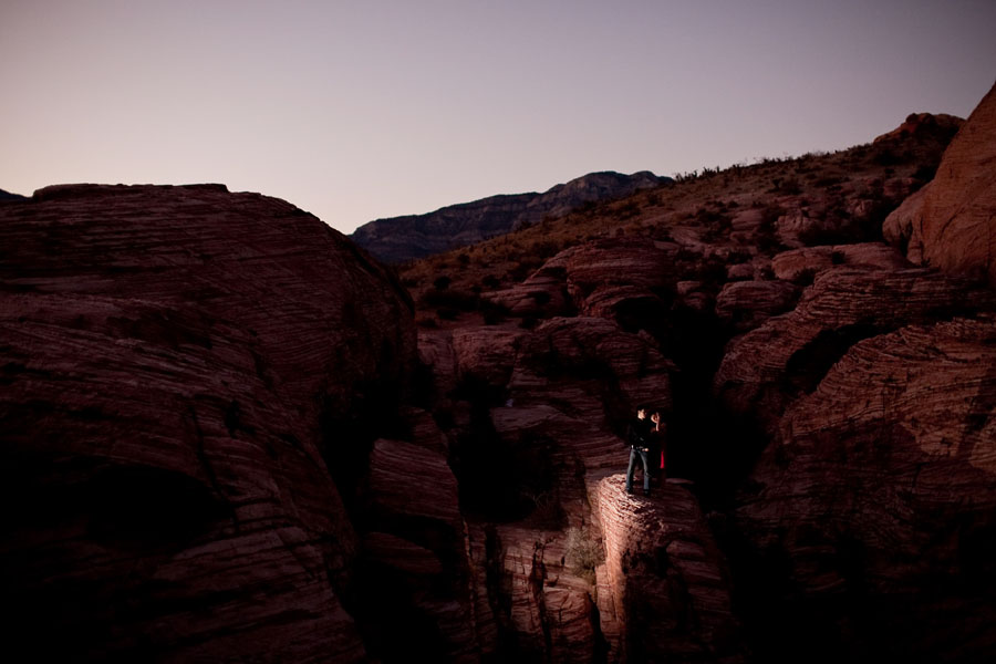 fun drama induced night time engagement images at red rock canyon in las vegas photographed by table4 weddings