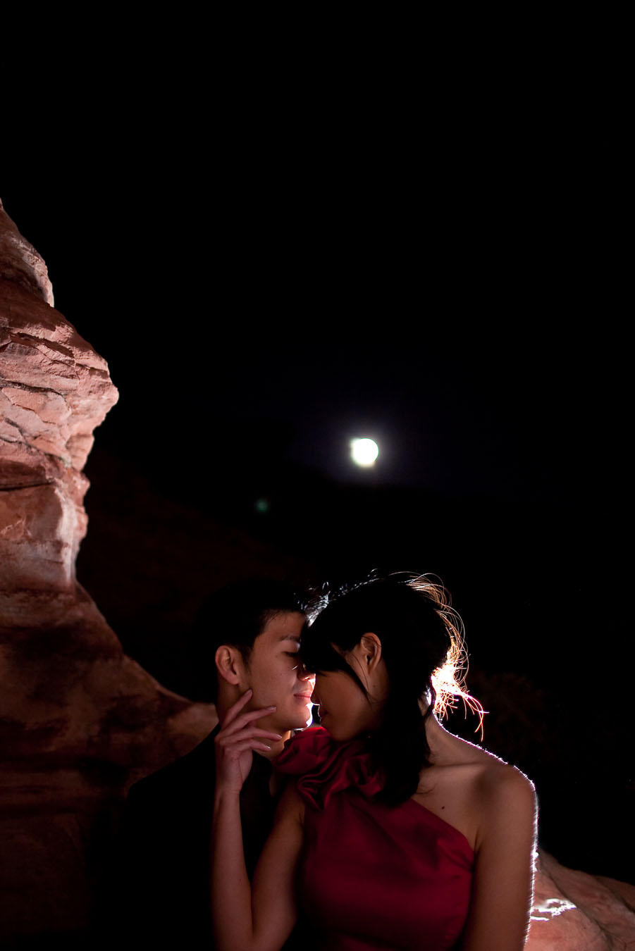 fun drama induced night time engagement images at red rock canyon in las vegas photographed by table4 weddings