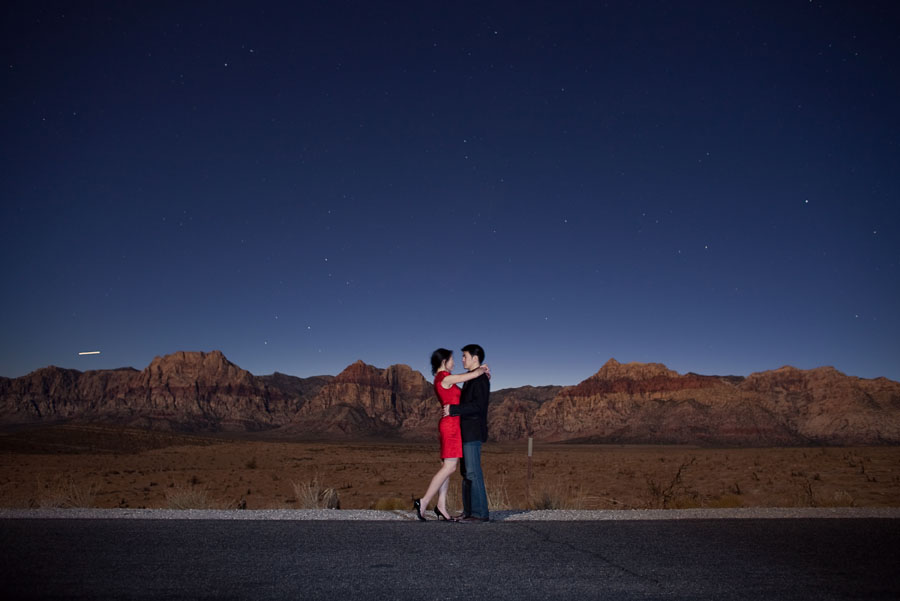 fun drama induced night time engagement images at red rock canyon in las vegas photographed by table4 weddings