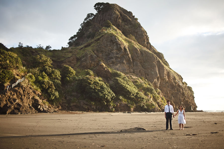 piha beach, lion rock, auckland new zealand engagement photo