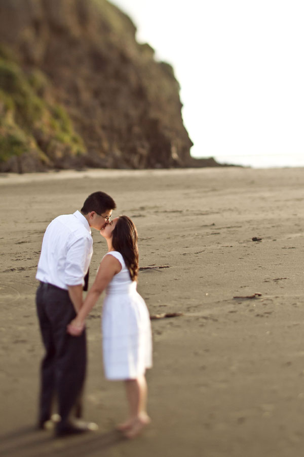 piha beach, auckland new zealand engagement photo