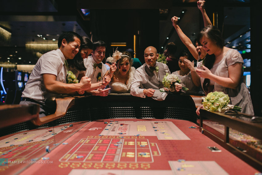 las vegas wedding, aria wedding, cosmopolitan wedding, craps table with wedding party