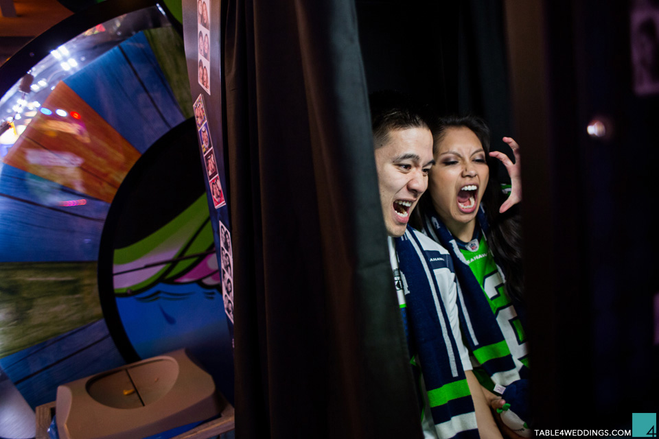 seattle seahawks fans at belmont park san diego carnival games engagement photo by wedding photographer jason huang table4 weddings