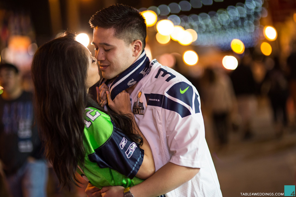 seattle seahawks fans at belmont park san diego carnival games engagement photo by wedding photographer jason huang table4 weddings