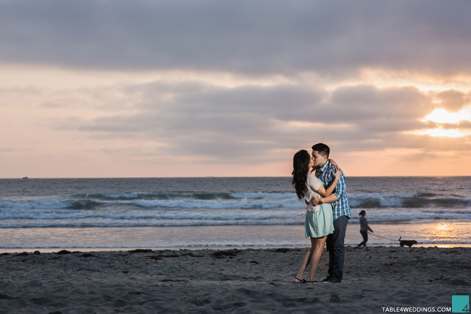 belmont park beach in san diego engagement photos at sunset by wedding photographer jason huang table4 weddings