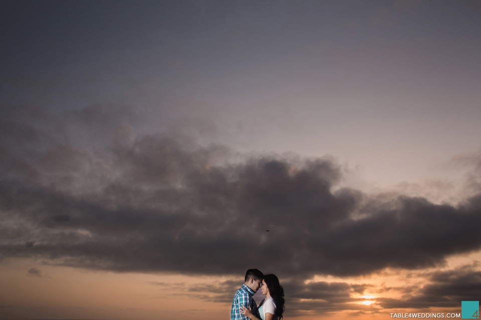 belmont park beach in san diego engagement photos at sunset by wedding photographer jason huang table4 weddings