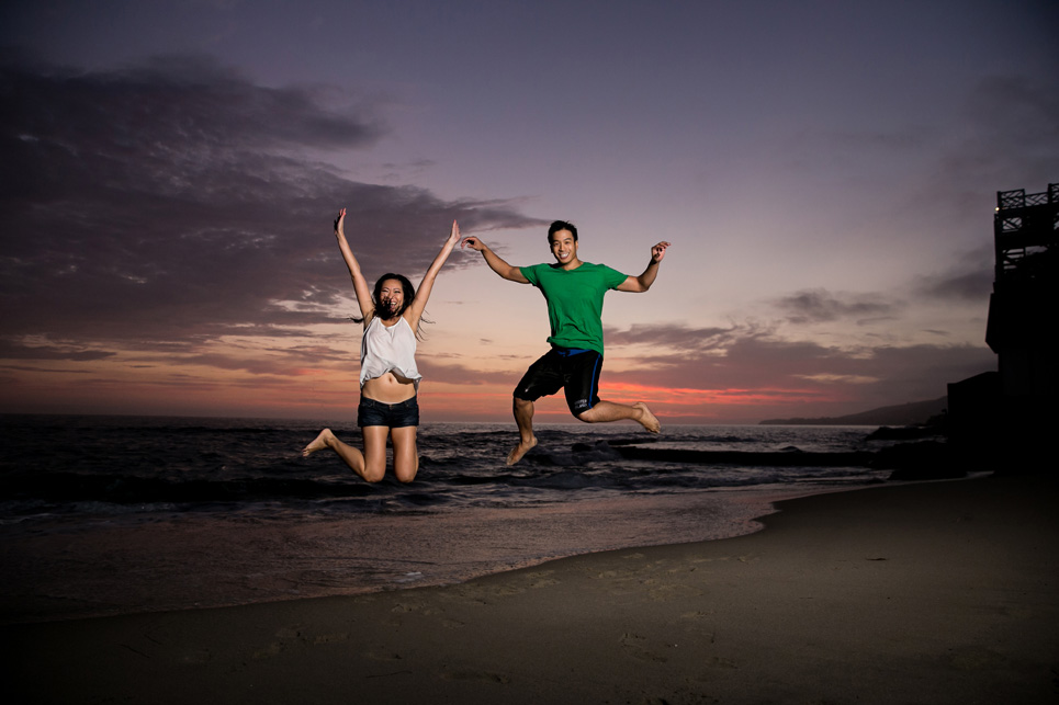 laguna beach sunset jumping engagement photo, sexy southern california wedding photographer jason huang