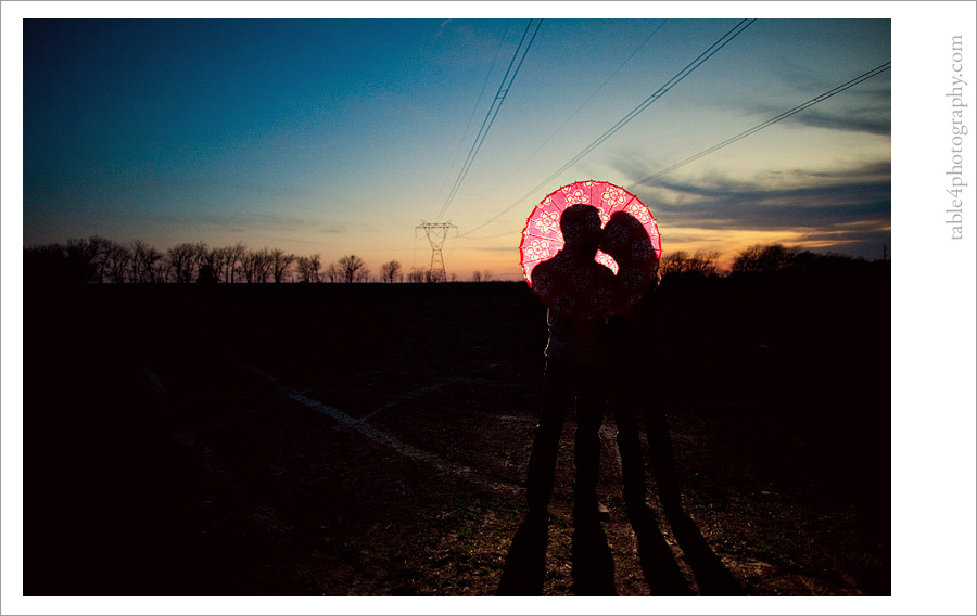 pink umbrella sunset engagement image