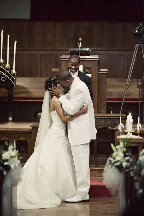 wedding first kiss, altar, pastor image